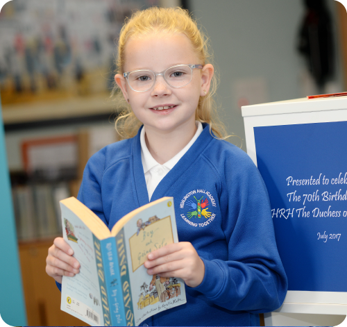 Girl in the school library with a book