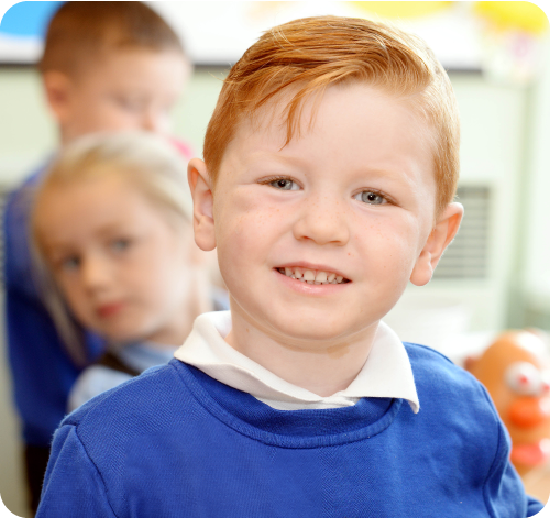 Boy at the school smiling